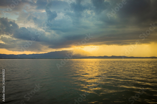 Sunset storm raining cloud © Theerapong