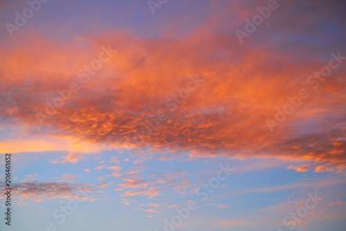 Sunset sky with orange clouds and blue © lunamarina