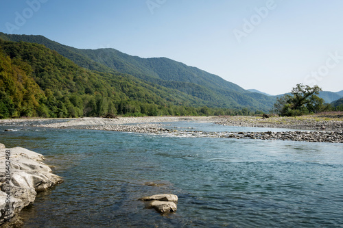 mountain river on a background of mountains and sky in the morning. Psezuapse. Sochi