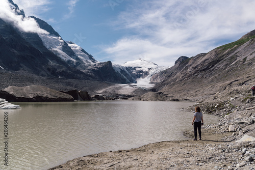 Rear view of woman on lake by glacier © jjfarq