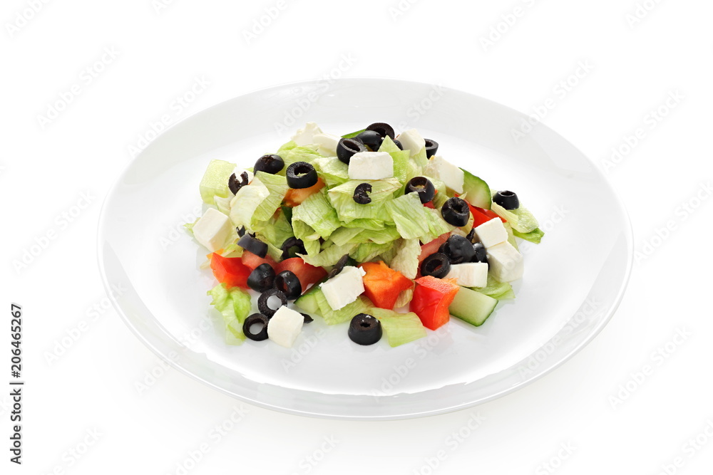 Greek salad with cheese and fresh vegetables on a white background isolated