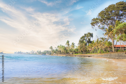 Beautiful view of the tropical beach of Sri Lanka on a sunny day photo