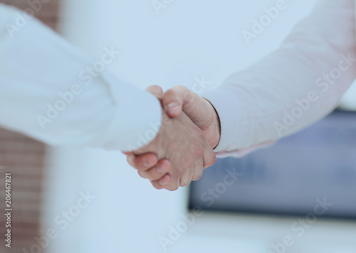 closeup. business handshake.business background.