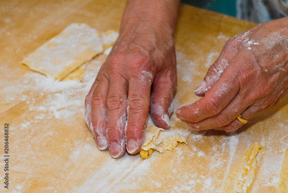 Expert hands while preparing a mixture for italian pasta.