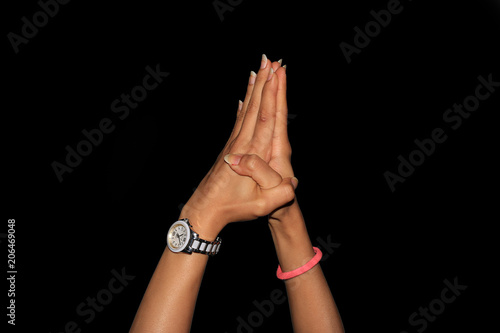 Young woman's hands addressing crowd