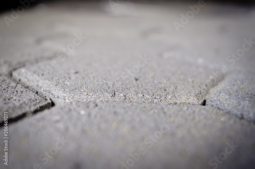 Motion blur image of cement building blocks trade stacked piled in warehouse development background. Closeup on fabric plant manufacture stockpile, grey textured abstract surface