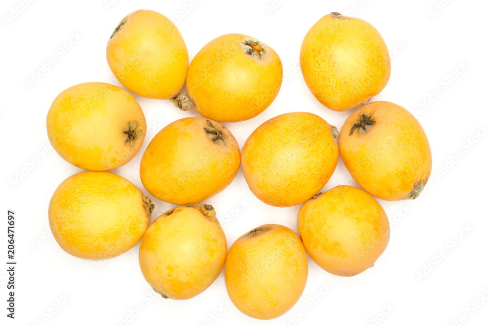 Fresh orange Japanese loquats top view isolated on white background.