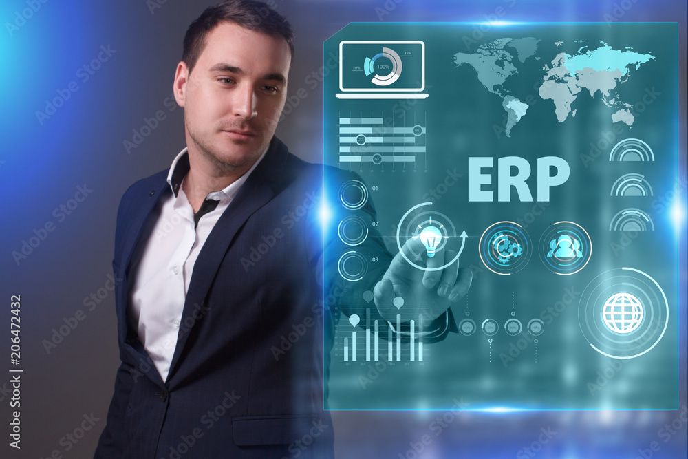 Business, Technology, Internet and network concept. Young businessman working on a virtual screen of the future and sees the inscription: ERP Business, Technology, Internet and network concept. Young businessman working on a virtual screen of the future and sees the inscription: ERP