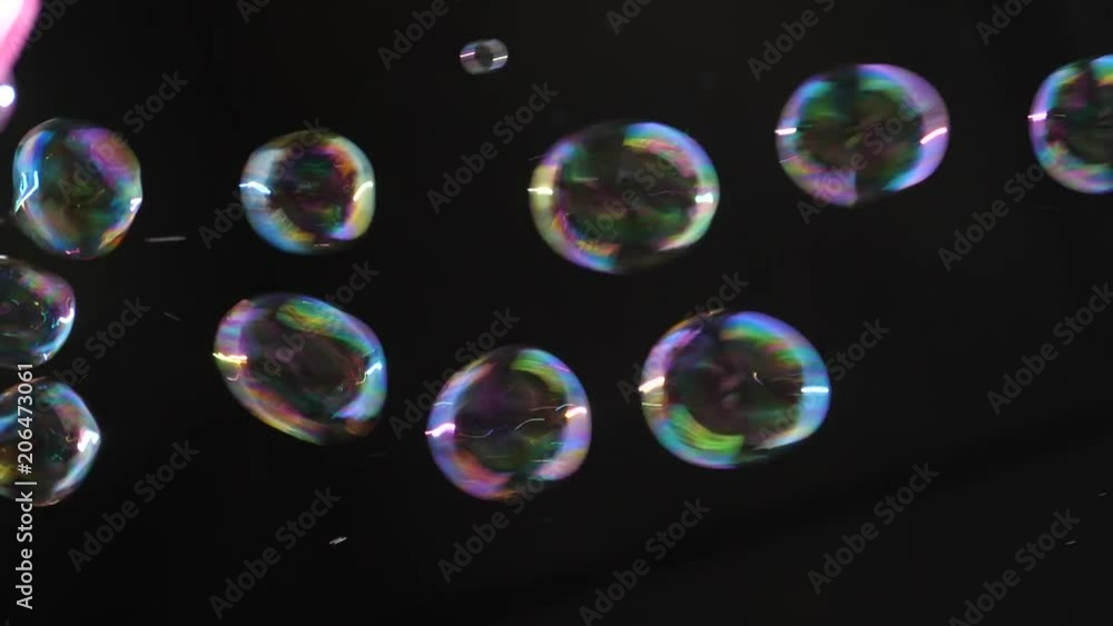 Flying soap bubbles on a dark background Flying soap bubbles on a dark background