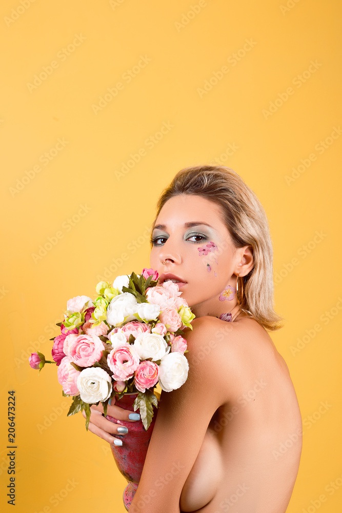 Portrait of a beautiful girl with clean skin in flowers Portrait of a beautiful girl with clean skin in flowers