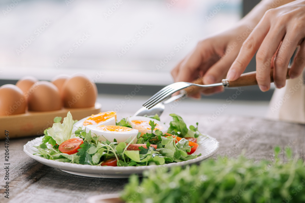 Lambs lettuce salad, hard-boiled eggs, tomatoes and honey mustard dressing Lambs lettuce salad, hard-boiled eggs, tomatoes and honey mustard dressing