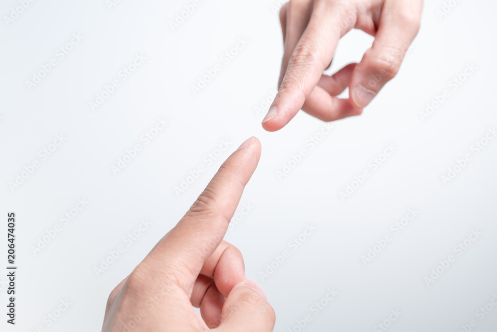 Business connection, finger point touching men and women hands reaching towards each other, almost touching. Diversity differential concept Business connection, finger point touching men and women hands reaching towards each other, almost touching. Diversity differential concept