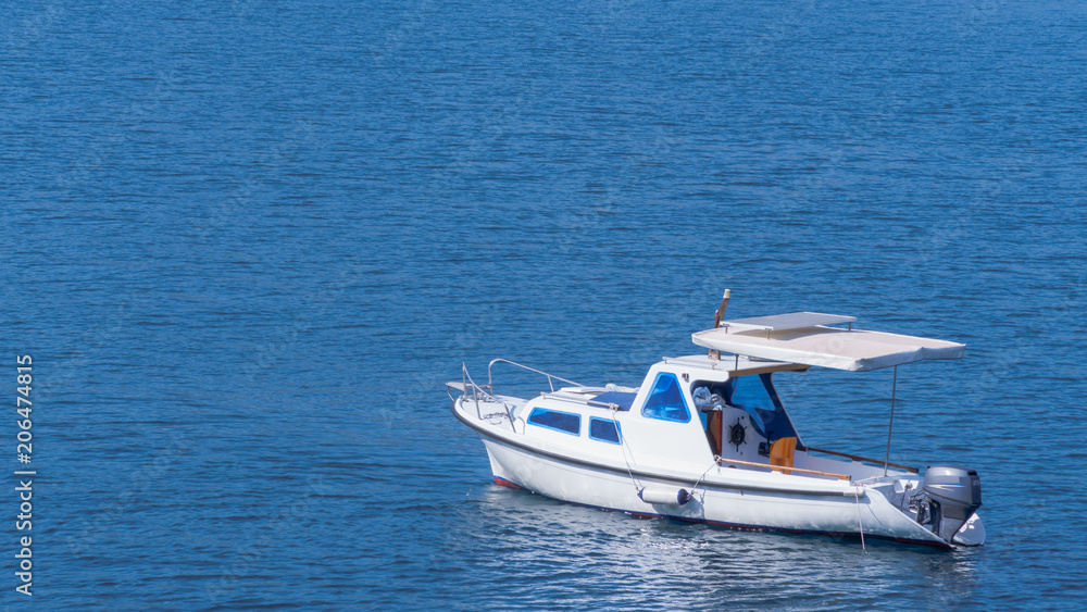 white boat in the blue sea