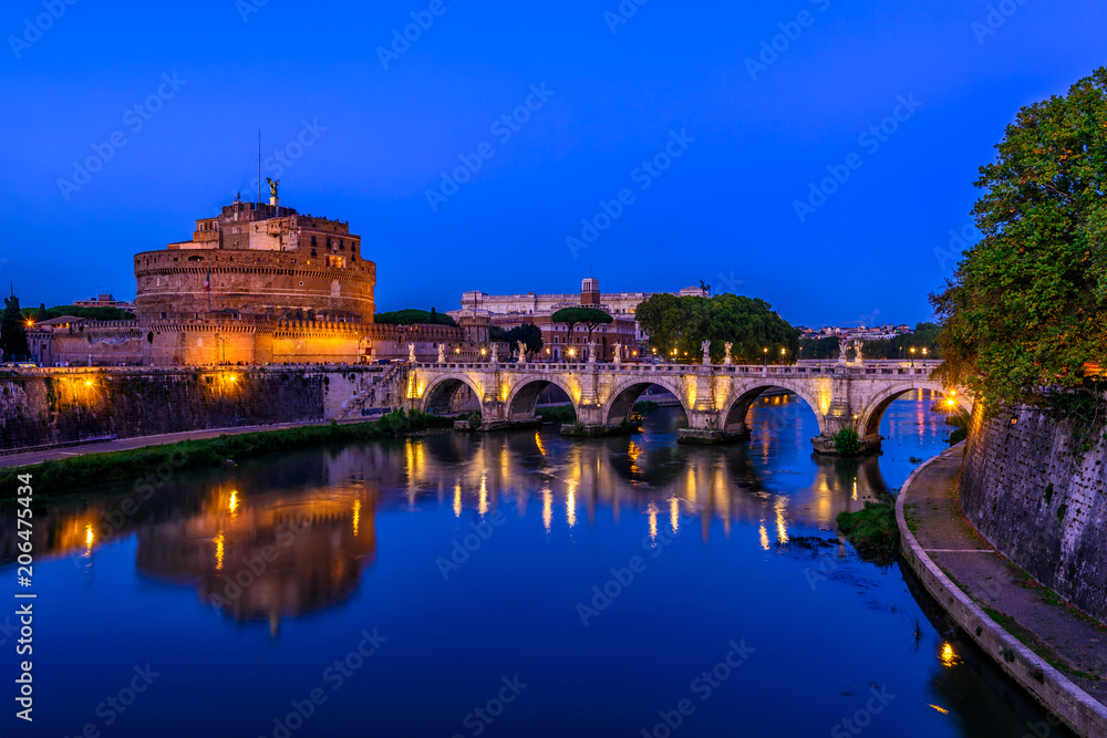 Night view of Castle Sant Angelo (Mausoleum of Hadrian), bridge Sant Angelo and river Tiber in Roma. Italy