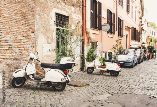 Fototapeta Naklejka Na Ścianę i Meble -  Old street in Trastevere, Rome, Italy. Trastevere is rione of Rome, on the west bank of the Tiber in Rome, Lazio, Italy.  Architecture and landmark of Rome