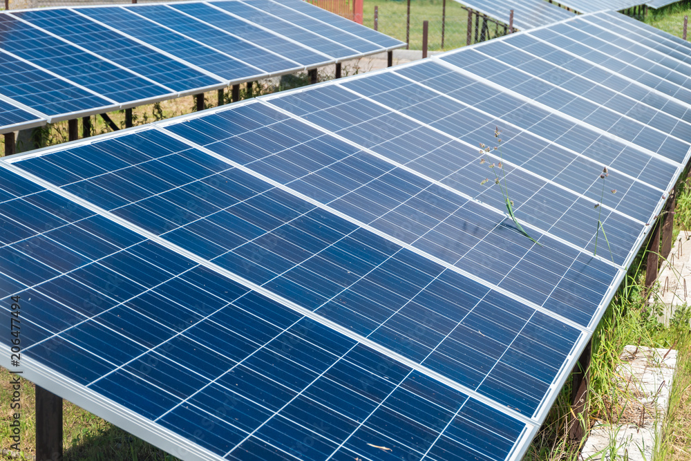 Solar panels near  residential quarter of the city. Renewable solar energy.