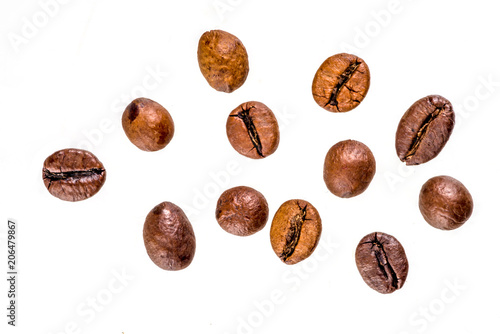 Golden roasted coffee beans isolated on white background