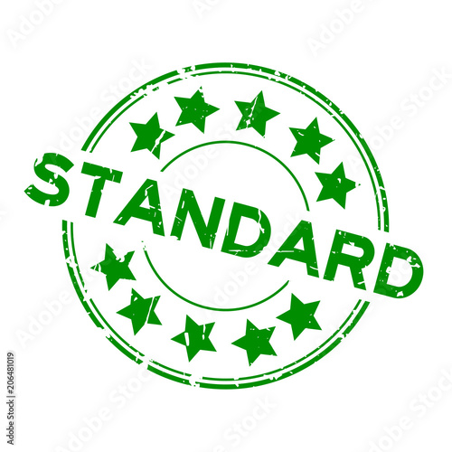 Grunge green standard wording with star icon round rubber seal stamp on white background photo
