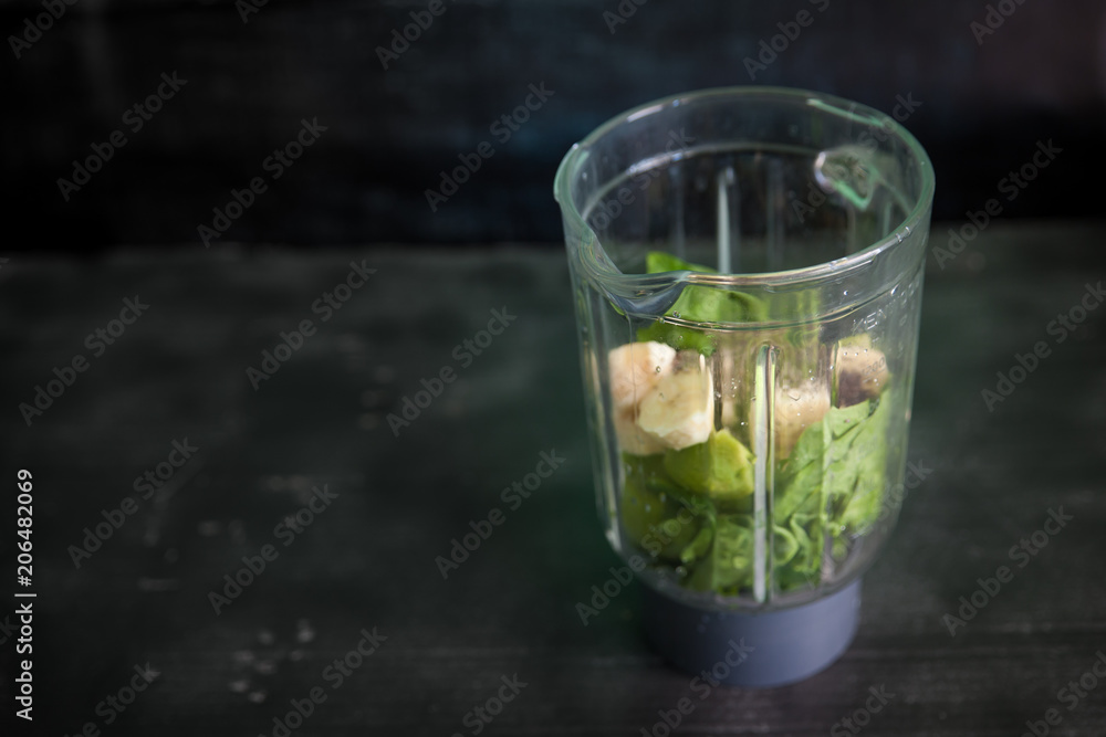 Preparing smoothie with spinach, kiwi, banana and chia Preparing smoothie with spinach, kiwi, banana and chia