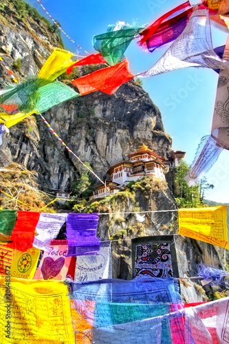 Colorful Buddhist prayer flags at Taktshang Goemba or Tiger's nest monastery in Paro, Bhutan