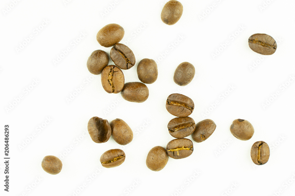 close up of medium or dark roasted coffee beans isolated on white background, can be used as a background or graphic object in your ads. close up of medium or dark roasted coffee beans isolated on white background, can be used as a background or graphic object in your ads.