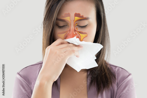 Women feeling unwell and sinus on gray background photo