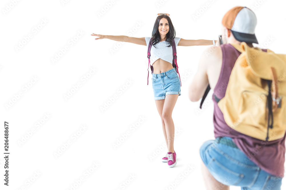 young couple of tourists taking photo on camera, isolated on white young couple of tourists taking photo on camera, isolated on white