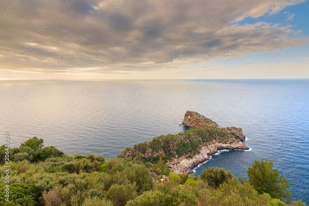 Sa Foradada relaxing mediterranean sunset. Golden hour seascape in Majorca island.