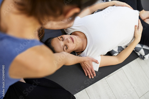 Pregnant Women Doing Yoga