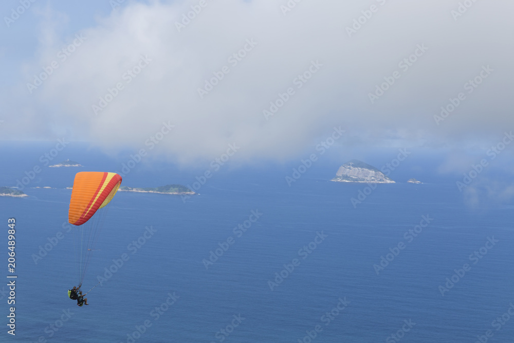 Paraglider flying over Sao Conrado in Rio de Janeiro. Paraglider flying over Sao Conrado in Rio de Janeiro.