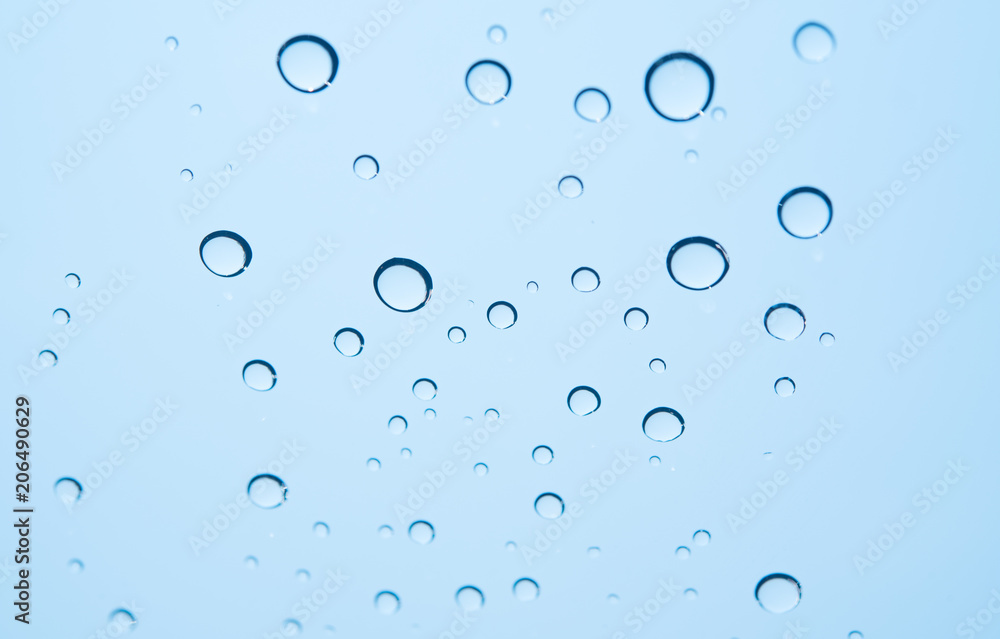 Water droplets on the glass as a backdrop.