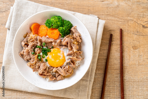 donburi, pork rice bowl with onsen egg and vegetable