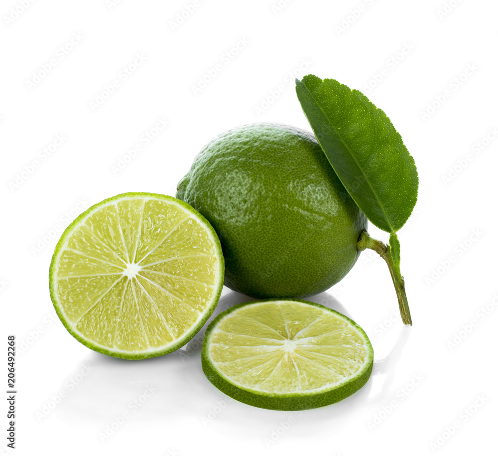 Lime with half and leaves isolated on white