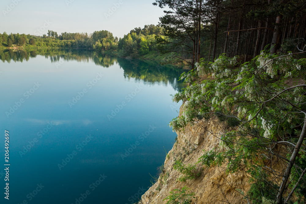 Turquoise lake Wapienniki near Sulejow, Lodzkie, Poland