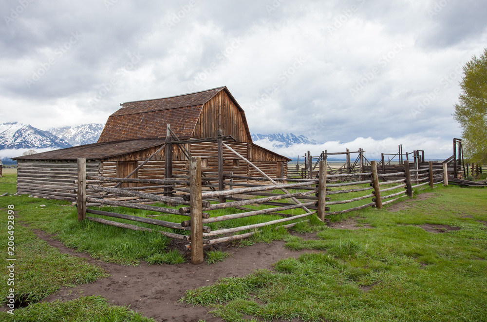 Log Cabin Barn in front of Mountains in the Grand Teton National Park