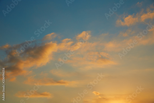 Sunset sky orange clouds on blue sky © lunamarina