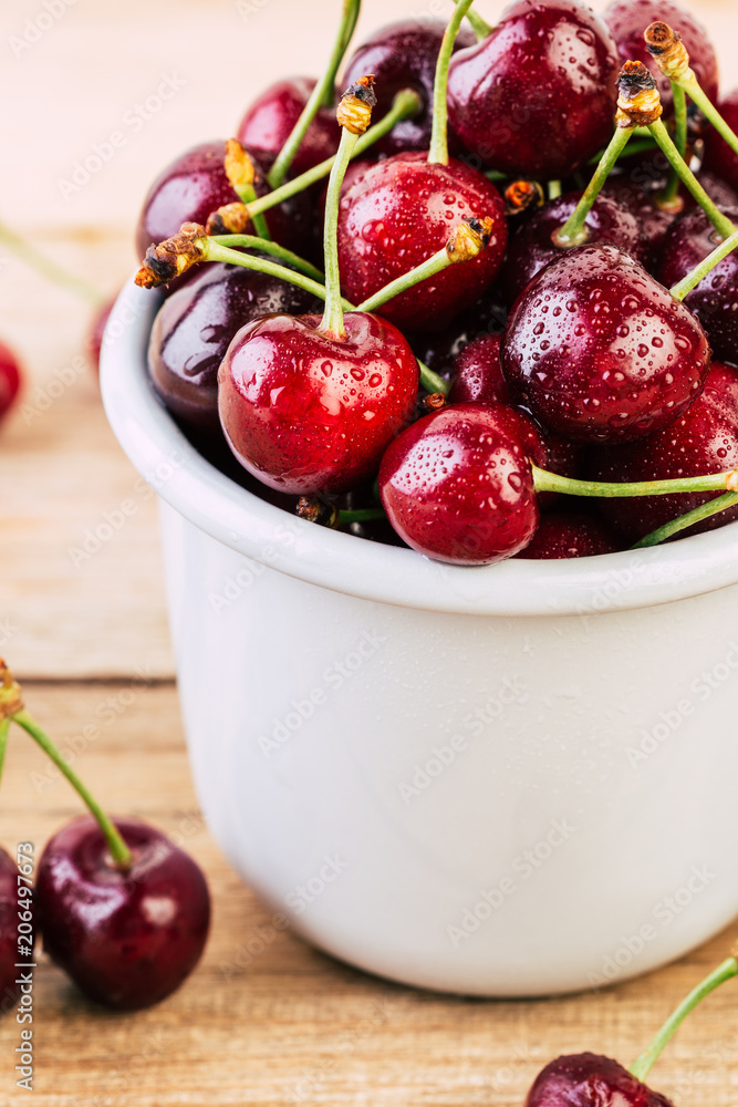 cherries in a white enamel mug on a wooden table, fresh cherry, seasonal berries, sweet cherry, ripe berries, berries in a mug cherries in a white enamel mug on a wooden table, fresh cherry, seasonal berries, sweet cherry, ripe berries, berries in a mug