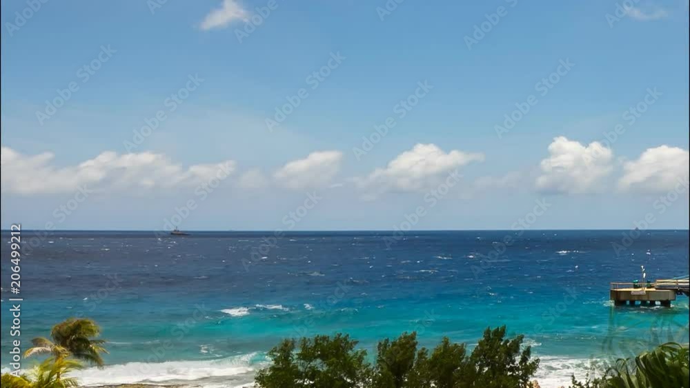 Time lapse of cruise ship docked at port on tropical island Time lapse of cruise ship docked at port on tropical island
