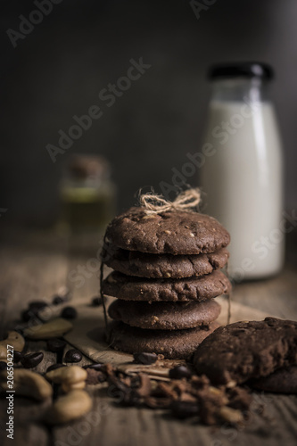 freshly baked chocolate chip cookies on rustic wooden table