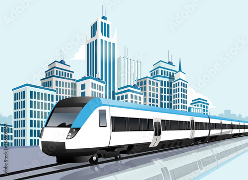 Speedy metro passing in front of modern city photo