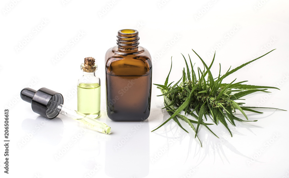 cannabis essential oil container with cannabis leaves cannabis essential oil container with cannabis leaves