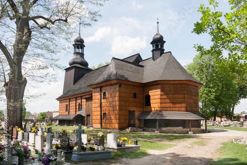 Originating from 1724, the Holy Trinity Church was built of wood on the foundation of stone and brick. It is carcass construction, oriented. It is part of the Wooden Architecture Trail. Koszecin photo