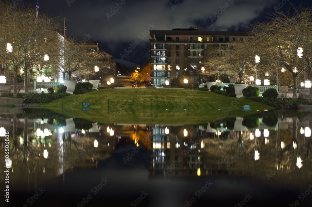 The reflection of temple square in the night sky of salt lake city. 
