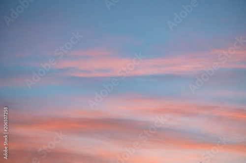 Dramatic sunset and sunrise sky with pink clouds