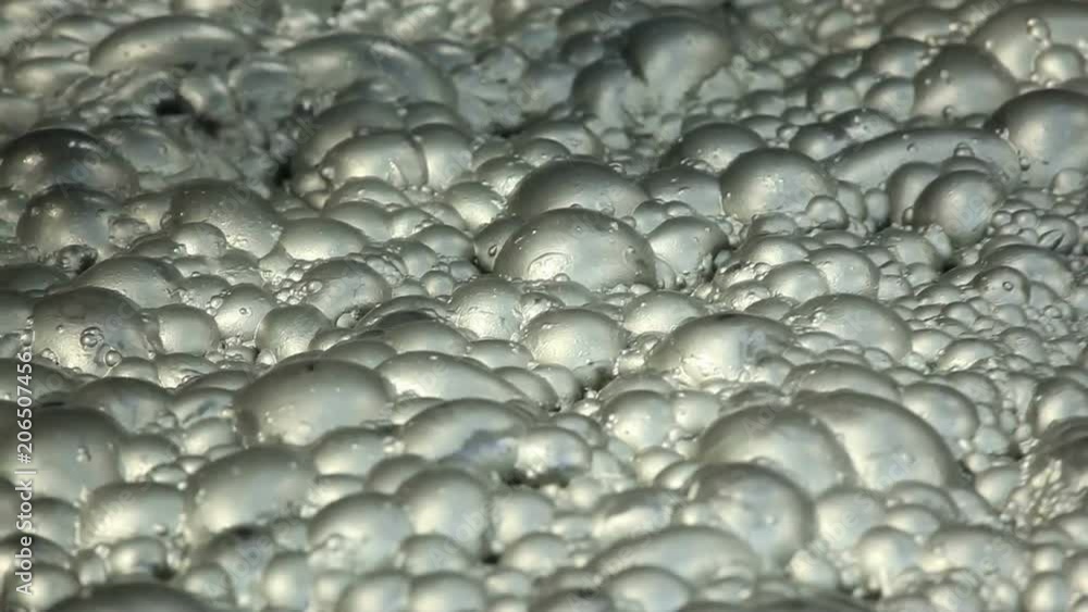 Copper-sulfide-loaded air bubbles on a Jameson Cell at the flotation plant in a Copper mine