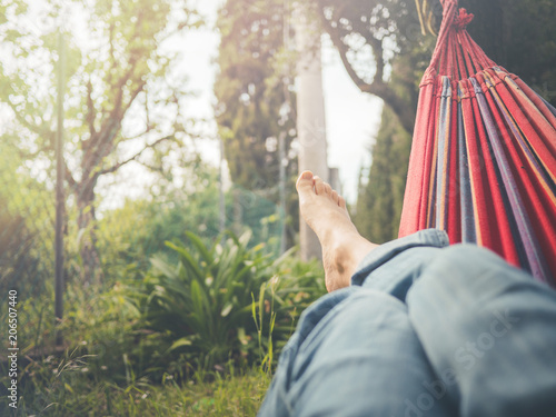 relaxing in the hammock, nude feet close up, spring day