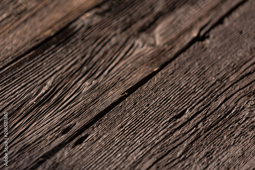 Dark wooden planks close up background