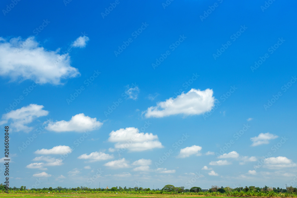 blue sky background with white clouds.