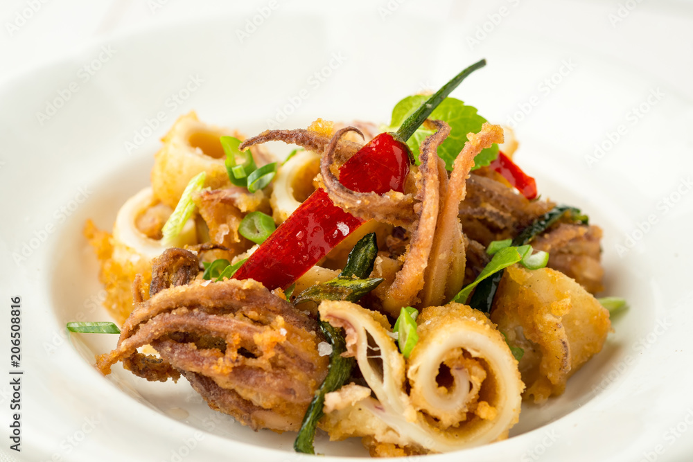 Fried Squids Tentacle Calamari with Chili Pepper and Mint Leaves