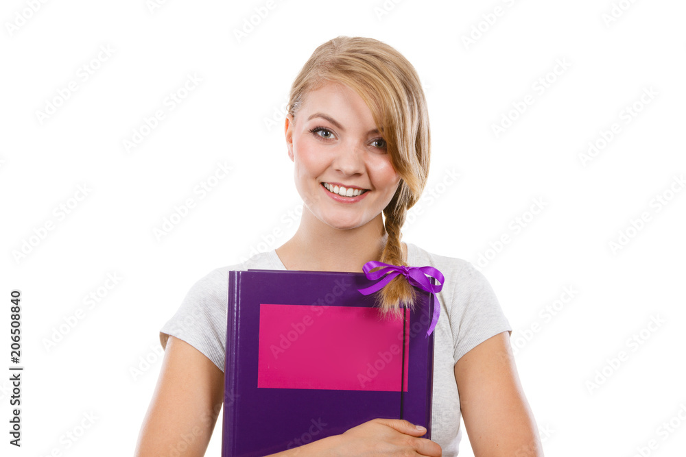 Young teenage student with braid holding books Young teenage student with braid holding books